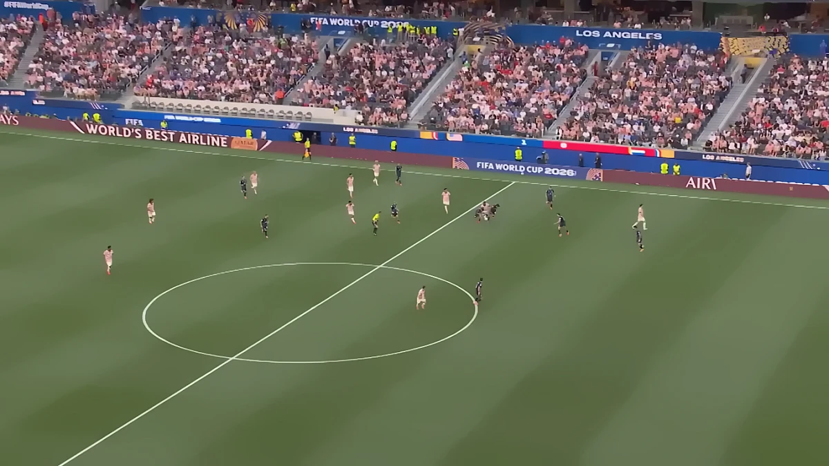 United States vs Paraguay at FIFA World Cup 2026 in Los Angeles — packed stadium with fans, banners, and scoreboard as the US national soccer team defeats Paraguay 4‑1. Players in dark blue (USA) and light uniforms with red accents (Paraguay) compete on the green field under the referee’s watch.