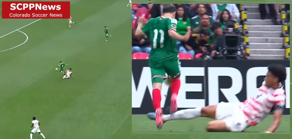 Intense tackle during a youth soccer match as a white‑shirted player slides to stop a green‑shirted attacker.